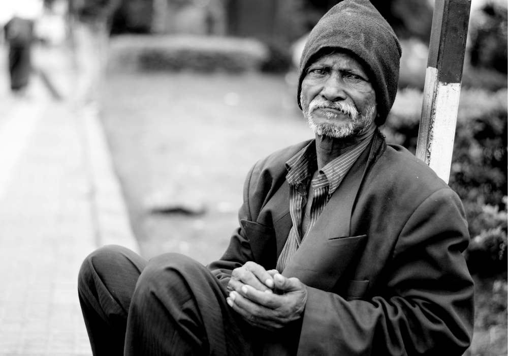 Black and white photo of a black homeless man