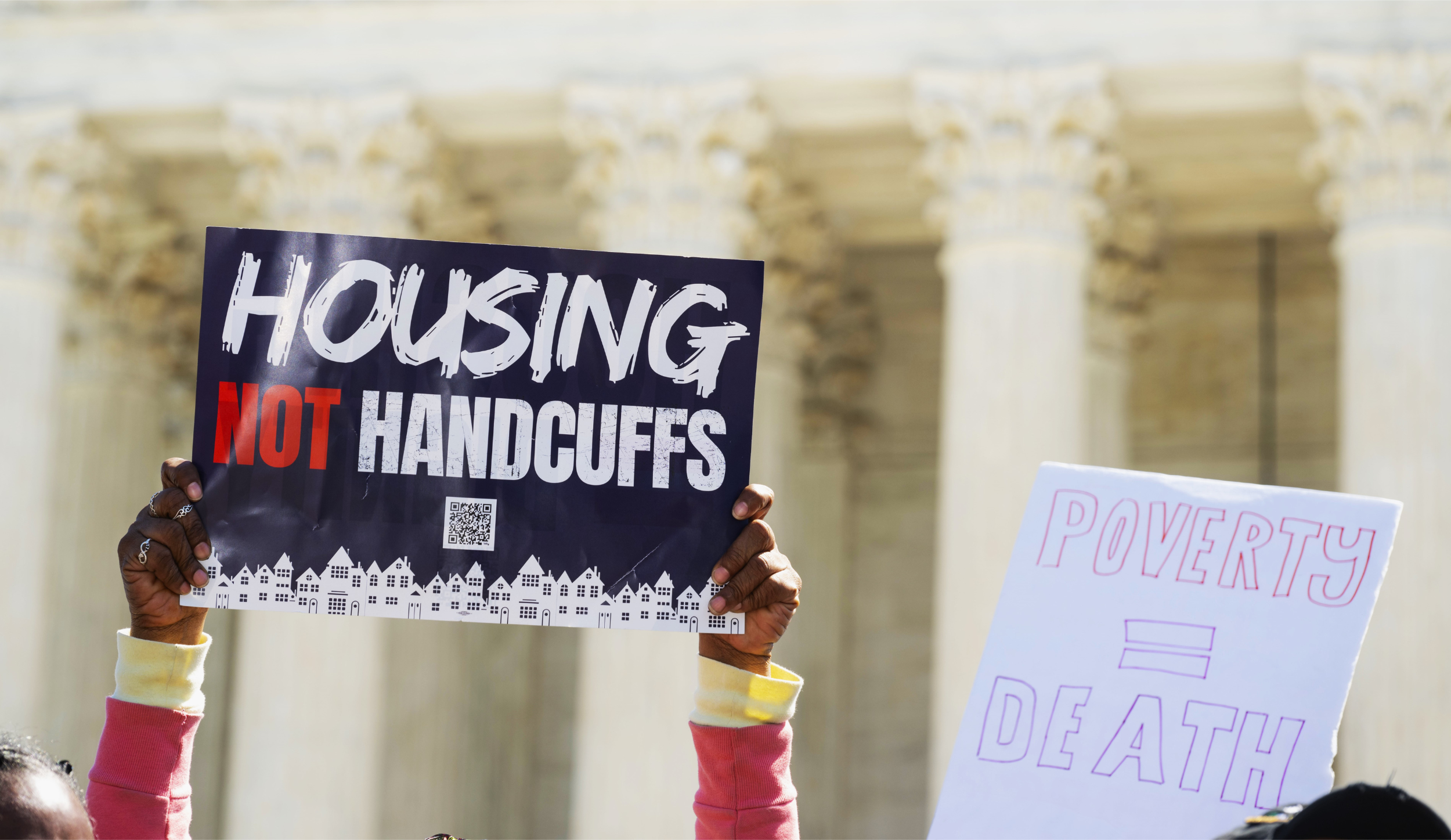 Housing Not Handcuffs rally sign